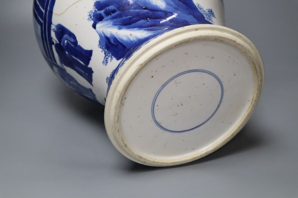 A Chinese Kangxi period blue and white baluster vase, repaired, 35cm